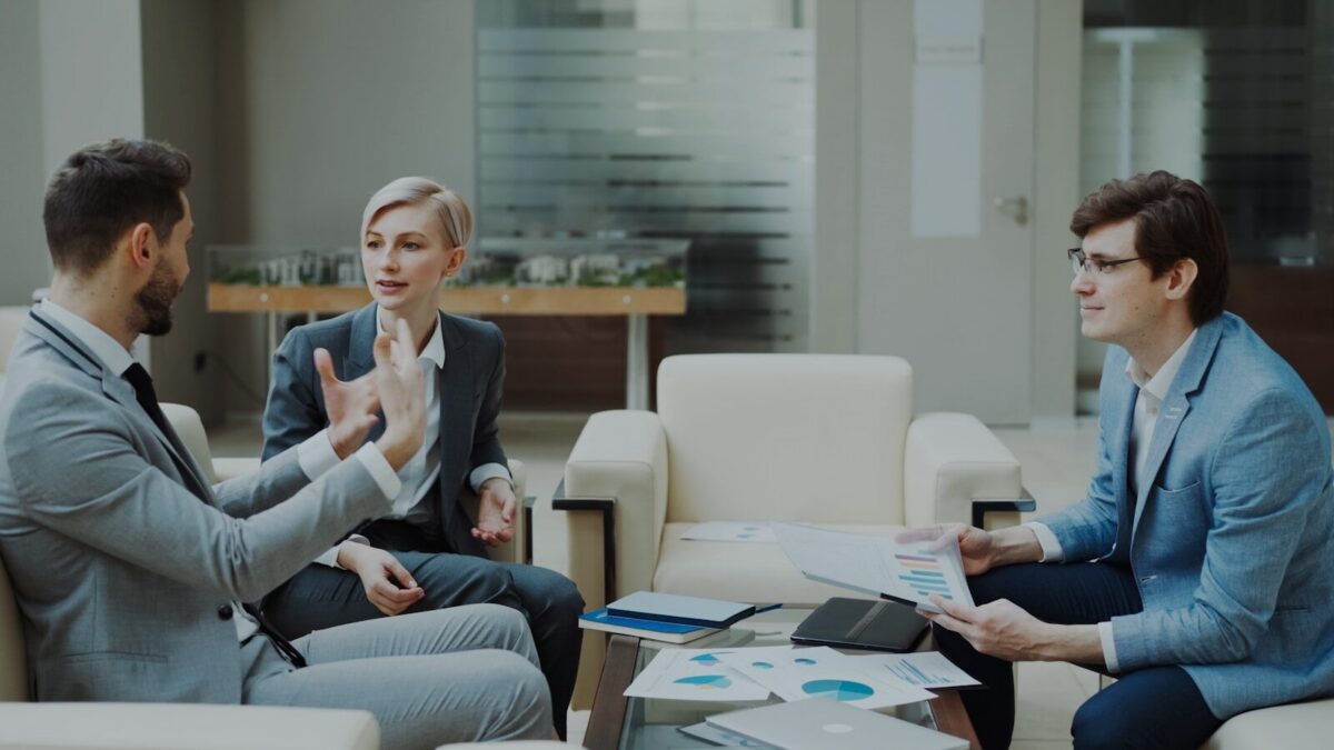Three business people in a meeting